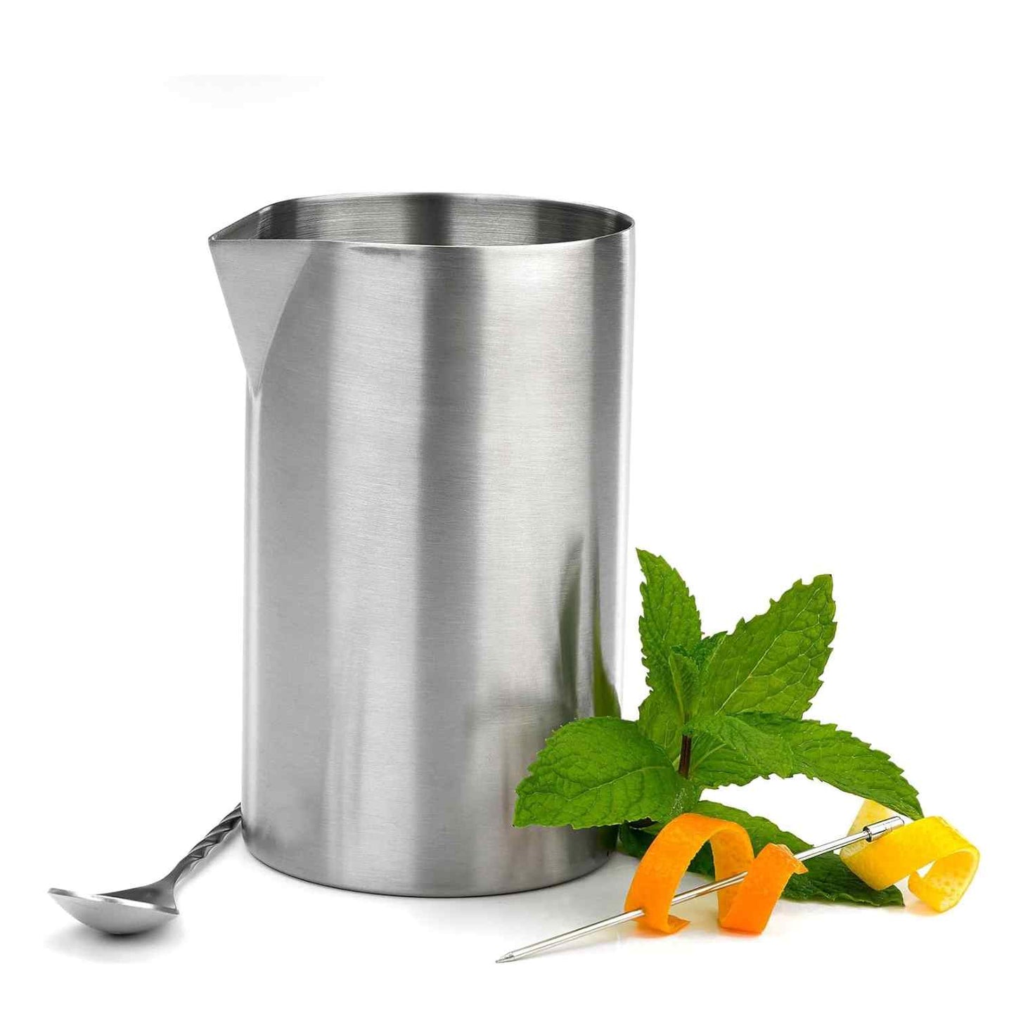 A Barfly Stainless Steel Double Wall Mixing Tin 21oz (625ml) shown next to a bar spoon, a sprig of mint, and a cocktail pick spearing orange and lemon peels on a white background