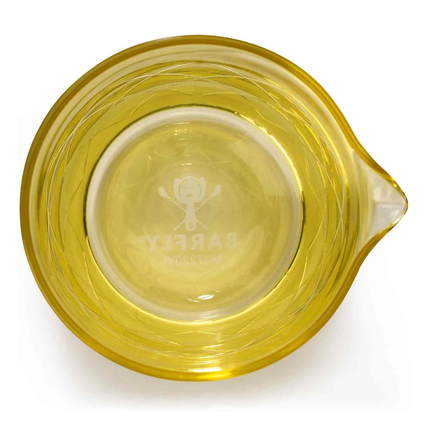 A close-up of the Gold Barfly Mixing Glass 17oz (500 ml) with geometric patterns on a white background