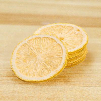 Freeze Dried Lemon Wheel Garnish on a wood